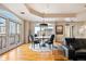 Dining area with large windows, views, a round table and hardwood floors at 1827 N Grant St # 1000, Denver, CO 80203