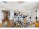 A spacious dining area blends seamlessly into the modern kitchen, illuminated by a stylish chandelier and natural light at 1827 N Grant St # 1000, Denver, CO 80203