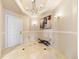 Elegant foyer with tiled floors, chandelier lighting, and artwork at 1827 N Grant St # 1000, Denver, CO 80203