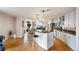 Modern kitchen with bar seating, stainless steel appliances, granite countertops and hardwood floors at 1827 N Grant St # 1000, Denver, CO 80203