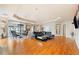 Open-concept living room with hardwood floors, fireplace, and modern furnishings at 1827 N Grant St # 1000, Denver, CO 80203