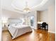 Bright main bedroom with balcony access, hardwood floors, and a sitting area at 1827 N Grant St # 1000, Denver, CO 80203