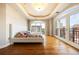 Bright and airy main bedroom with hardwood floors, and large windows offering city views at 1827 N Grant St # 1000, Denver, CO 80203
