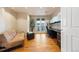 Well-lit office with built-in shelving, a comfortable sofa, and a private balcony, perfect for remote work at 1827 N Grant St # 1000, Denver, CO 80203