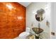 Unique powder room with modern fixtures, glass bowl sink, and wood-paneled accent wall at 1827 N Grant St # 1000, Denver, CO 80203