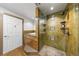 A spacious walk-in shower features decorative tile accents and a glass door, with an adjacent soaking tub at 1827 N Grant St # 1000, Denver, CO 80203