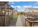 The backyard features a pergola, garden beds, and a pathway leading to the garage and additional space at 3649 N Garfield St, Denver, CO 80205