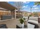 Inviting backyard includes a hot tub, shaded seating area, and raised garden beds for relaxation and gardening at 3649 N Garfield St, Denver, CO 80205