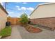Landscaped backyard with gravel, mulch and a wooden fence at 3649 N Garfield St, Denver, CO 80205