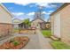 Backyard view showcasing a raised garden bed and a pergola-covered seating area at 3649 N Garfield St, Denver, CO 80205