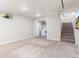 Finished basement area with carpet, laundry, access to stairs, and a window for natural light at 3649 N Garfield St, Denver, CO 80205