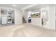Finished basement with carpet, laundry area, a full bathroom and bedroom in the background at 3649 N Garfield St, Denver, CO 80205
