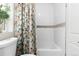 Bright bathroom featuring a tub and a white subway tile surround and a floral curtain at 3649 N Garfield St, Denver, CO 80205