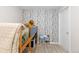 Cozy bedroom with themed wallpaper, a bunk bed, and playful decor adds character to the living space at 3649 N Garfield St, Denver, CO 80205