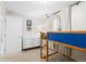 Cozy bedroom featuring a loft bed, a white dresser, and a window with natural light at 3649 N Garfield St, Denver, CO 80205