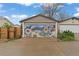 Garage door artfully designed with a vibrant mural enhances the curb appeal and adds a creative touch at 3649 N Garfield St, Denver, CO 80205