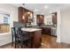 Beautiful kitchen featuring dark wood cabinetry, granite countertops, and stainless steel appliances at 3649 N Garfield St, Denver, CO 80205