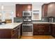Well-equipped kitchen featuring stainless steel appliances, ample counter space, and modern lighting at 3649 N Garfield St, Denver, CO 80205