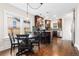 Modern kitchen with dark wood cabinets, stainless steel appliances, and adjacent dining area at 3649 N Garfield St, Denver, CO 80205