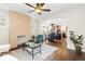 Inviting living room with hardwood floors, decorative fireplace, and open floor plan to dining and kitchen at 3649 N Garfield St, Denver, CO 80205