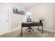 A bright office space features an office desk, a neutral color palette and natural light at 3649 N Garfield St, Denver, CO 80205
