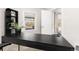 Office area featuring a dark desk near a window, offering natural light and modern fixtures at 3649 N Garfield St, Denver, CO 80205