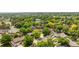 Expansive aerial view of a lush neighborhood with mature trees and well-maintained homes in a suburban setting at 12414 Clayton Way, Thornton, CO 80241
