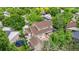 Aerial view of home featuring large backyard with deck, patio, trampoline, and mature landscaping at 12414 Clayton Way, Thornton, CO 80241