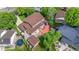 Aerial view of backyard featuring a deck, patio, lawn, shed, trampoline, and landscaping at 12414 Clayton Way, Thornton, CO 80241