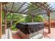 Outdoor spa with a wooden pergola creating a relaxing backyard getaway at 12414 Clayton Way, Thornton, CO 80241
