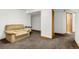 Finished basement features new carpet and a cozy couch at 12414 Clayton Way, Thornton, CO 80241