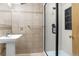 Bathroom features glass-door shower and single sink at 12414 Clayton Way, Thornton, CO 80241