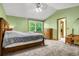 Green bedroom featuring vaulted ceiling, large windows, and walk-in closet at 12414 Clayton Way, Thornton, CO 80241