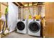 Laundry room features full size washer and dryer at 12414 Clayton Way, Thornton, CO 80241