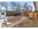 Spacious backyard featuring a shed, planting bed, and wood fence at 1195 Ammons St, Lakewood, CO 80214