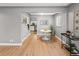 Open-concept dining area with sleek furniture and modern decor at 1195 Ammons St, Lakewood, CO 80214