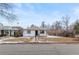 Charming single-story home with a well-maintained front lawn and inviting curb appeal at 1195 Ammons St, Lakewood, CO 80214