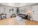 Cozy living room with a leather sofa and ample natural light at 1195 Ammons St, Lakewood, CO 80214