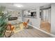 Open living room with fireplace and adjacent view to the kitchen at 1195 Ammons St, Lakewood, CO 80214