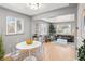 Inviting living space with natural light, seamlessly connecting to the dining area at 1195 Ammons St, Lakewood, CO 80214