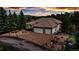 Lovely home with a three-car garage, manicured landscaping, and a circular drive at 730 Summerwood Dr, Golden, CO 80401