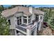 This house features a balcony with outdoor seating for relaxing and enjoying the outdoors at 730 Summerwood Dr, Golden, CO 80401