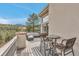 Inviting outdoor living space with stylish wicker furniture and scenic views on a sunny day at 730 Summerwood Dr, Golden, CO 80401
