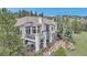 Lovely home with an outdoor patio, a charming balcony, mature trees, and professional landscaping at 730 Summerwood Dr, Golden, CO 80401