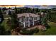 Beautiful home featuring outdoor living space and landscaped yard nestled among mature trees in a serene setting at 730 Summerwood Dr, Golden, CO 80401