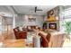 Cozy living room showcasing a stone fireplace, wood floors, comfortable leather furniture, and decor at 730 Summerwood Dr, Golden, CO 80401