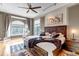 Spacious main bedroom with cozy textures, decorative ceiling fan and abundant natural light at 730 Summerwood Dr, Golden, CO 80401