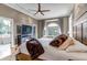 Beautifully appointed bedroom with fireplace feature and doorway to a tub and private balcony at 730 Summerwood Dr, Golden, CO 80401