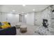 Finished basement area features a charming stone fireplace and new carpeting at 3540 E 91St Ave, Thornton, CO 80229