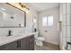Modern bathroom featuring a stylish vanity, and a shower with white subway tile at 3540 E 91St Ave, Thornton, CO 80229